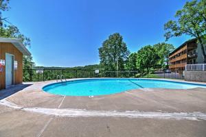 a swimming pool in a parking lot at 1 Mi to Silver Dollar City Branson West Condo in Branson West