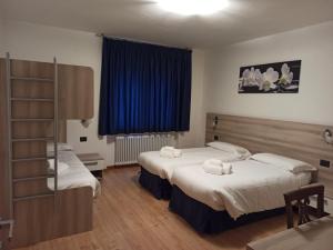 Ένα ή περισσότερα κρεβάτια σε δωμάτιο στο Appartamento DIAMANTE