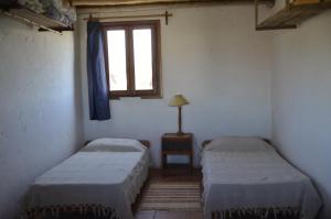 Postel nebo postele na pokoji v ubytování La Posada