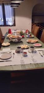 
a table with plates of food on it at Posada del tiempo in Villavieja del Lozoya
