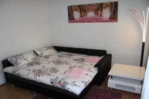 Кровать или кровати в номере Gemütliche City Wohnung - Im Herzen von Trier