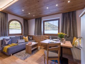 a living room with a couch and a table at Ferienwohnung Garber in Zell am Ziller