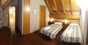 A bed or beds in a room at Excelsior. Espectacular y exclusivo apartamento en Sallent de Gállego.