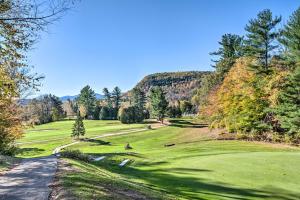 a view of a golf course with trees and a road at Charming Jackson Mountain Retreat on Golf Course! in Jackson