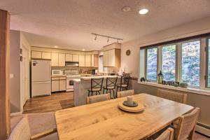 a kitchen and dining room with a wooden table at Charming Jackson Mountain Retreat on Golf Course! in Jackson