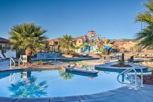 a large swimming pool with a water park at Utah Home with Pool and Hot Tub Access, Mtn Views! in Santa Clara