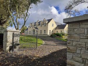 a house with a gate in front of it at Private Room in Superb House Bed 1 in Nobber