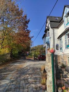 a cobblestone street in front of a house at art-house 3 attic apartment with terrace in Děčín