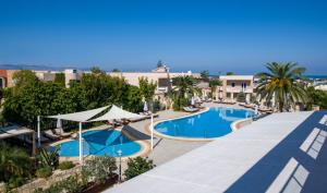 an image of a swimming pool at a resort at Isida Hotel Agia Marina in Agia Marina Nea Kydonias