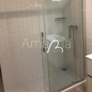 a shower with a glass door in a bathroom at AmaRiaCity AL in Aveiro +31 photos