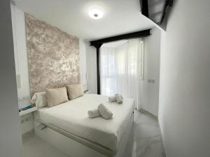 En eller flere senger på et rom på Apartamento IMPERIO 3 - Puerto deportivo Playa Marbella