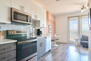 a kitchen with a sink and a stove top oven at Sonder at Hance Park in Phoenix