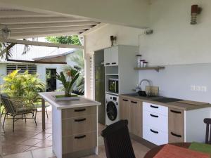 Kuchyň nebo kuchyňský kout v ubytování Villa Rose Caraibes