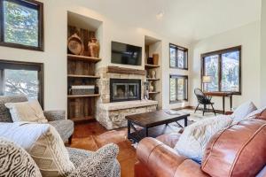 a living room with a couch and a fireplace at 10 N Fairway Drive in Beaver Creek