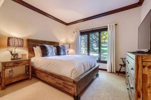 a bedroom with a large bed and a window at 10 N Fairway Drive in Beaver Creek