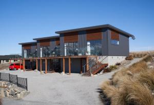 a house on the side of a hill at Alpine View Apartment 2 - Tekapo in Lake Tekapo