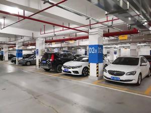 a group of cars parked in a parking lot at Hotel Apartment, Studio, Free Swimming Pool, Gym, Kitchen in Dubai