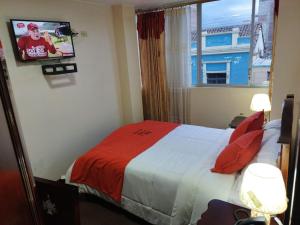 Postel nebo postele na pokoji v ubytování HOTEL VELANEZ SUITE Riobamba