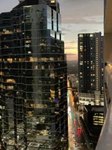 a view of a tall building in a city at Brickell Apartments with Oceanview in Miami