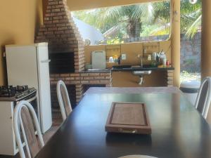 a kitchen with a table with a tray on top of it at Aconchego da Nina in Jijoca de Jericoacoara