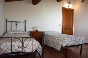 Posteľ alebo postele v izbe v ubytovaní Agriturismo Podere Casalone + 37 fotografií