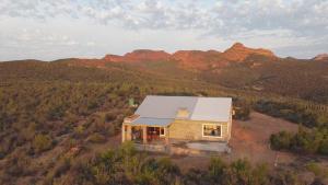 an aerial view of a house in the middle of a mountain at Zwartberg View Mountain Lodge in Oudtshoorn