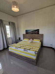 a bedroom with a bed with a pig head on it at Baan Klang Khao Mountain Viewบ้านกลางเขา เมาเทนวิว in Ban Pang Asok +98 photos