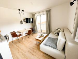 TV a/nebo společenská místnost v ubytování PAM Apartments