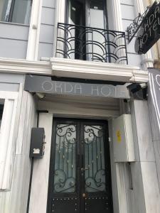 The facade or entrance of Okda Hotel