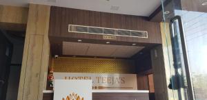 a front door of a tahan teaks building at Hotel Teeja's - Haldi Restaurant Aiims road Jodhpur in Jodhpur