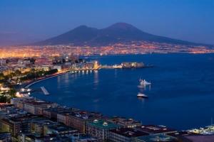a large body of water with a boat in it at IL GECO in Naples