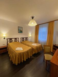 Katil atau katil-katil dalam bilik di Gusarskiy Hotel and Apartment