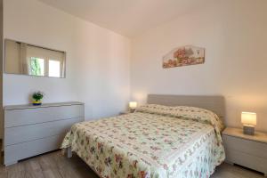 A bed or beds in a room at Ionio apartment