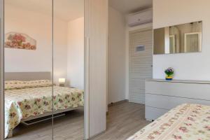 A bed or beds in a room at Ionio apartment