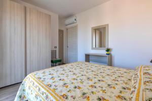 Posteľ alebo postele v izbe v ubytovaní Tirreno apartment