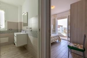 Posteľ alebo postele v izbe v ubytovaní Tirreno apartment