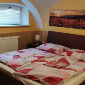 Postel nebo postele na pokoji v ubytování Hotel Jeleň