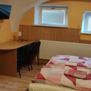 Postel nebo postele na pokoji v ubytování Hotel Jeleň