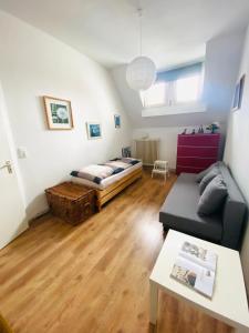 a living room with a bed and a couch at Hannover List 2 bedroom home away from home in Hannover