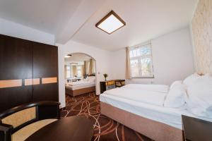 Posteľ alebo postele v izbe v ubytovaní Hotel Hubertus