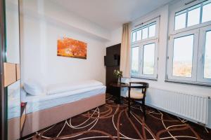 Posteľ alebo postele v izbe v ubytovaní Hotel Hubertus