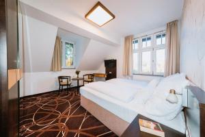 Posteľ alebo postele v izbe v ubytovaní Hotel Hubertus