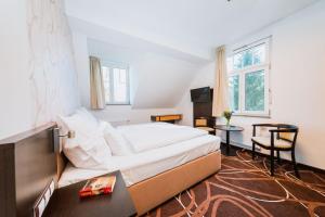 Posteľ alebo postele v izbe v ubytovaní Hotel Hubertus