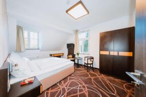 Posteľ alebo postele v izbe v ubytovaní Hotel Hubertus