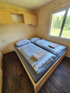 Posteľ alebo postele v izbe v ubytovaní Palčovka - apartmán U Štěpána a U Dorotky