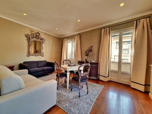 a living room with a couch and a table at Hotel Balestri - WTB Hotels in Florence
