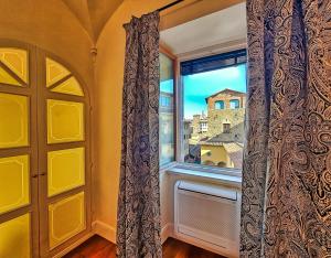 a room with a window and a door at Hotel Balestri - WTB Hotels in Florence