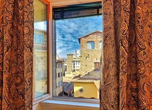 a window with a view of a city at Hotel Balestri - WTB Hotels in Florence