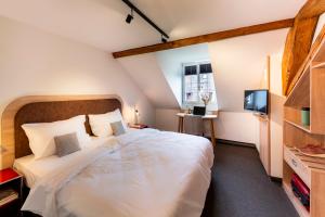 Letto o letti in una camera di KONCEPT HOTEL Löie