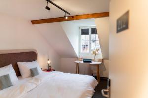 Letto o letti in una camera di KONCEPT HOTEL Löie